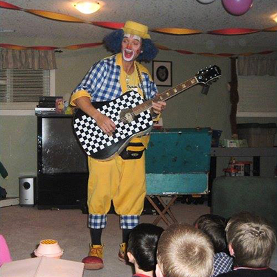 Chester playing guitar at house party